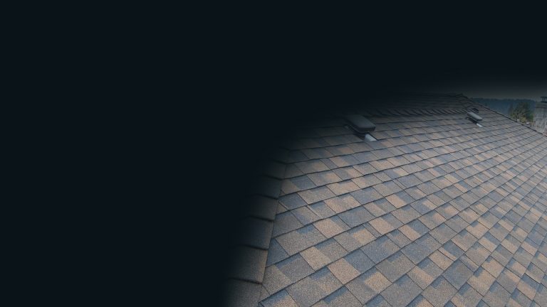 Close view of an asphalt shingle roof surface