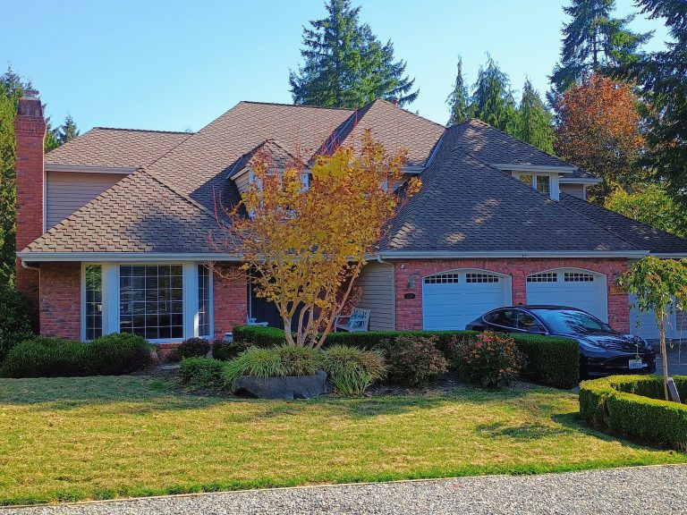 Composition roof on a brick house completed by B&J Roofing